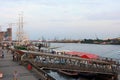 View of St. Pauli piers in the summer evening with green sailboat Rickmer Rickmers Royalty Free Stock Photo