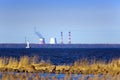 View of St. Petersburg through the Gulf of Finland. Pipes of a thermal power plant in the center