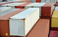 Stack of the containers loaded on deck of the cargo ship.