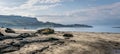 A view of Staffin island and Staffin harbour. Garrafad bay and An Corran Beach. People on the beach searching for dinosaur