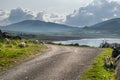 A view of Staffin island and Staffin harbour. Garrafad bay and An Corran Beach. Seaweed on the beach. A road along the bay