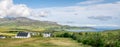 A view of Staffin village on the Isle of Skye with Quiraing Hills in the background