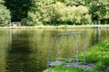 View of the stainless steel ladder to the pond