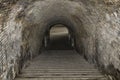 A view of the staircase leading down the tunnel into an ancient dungeon