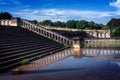 Stairs and historical ancient wall from the Victorian style reflected in the water Royalty Free Stock Photo