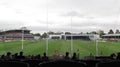 View from the stands behind the goal post line during a footy game at Ikon Park Stadium