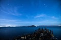 A view of the stars of the Milky Way with a mountain top in the foreground. Royalty Free Stock Photo