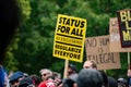 View of Status For All No Exclusions Regularize Everyone banner at pro-immigrant rally. Royalty Free Stock Photo