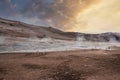 View of steam emitting from crater in geothermal area of Hverir during sunset Royalty Free Stock Photo