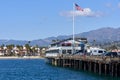 A view of Stearns Wharf, Santa Barbara, with the beach and mountains behind Royalty Free Stock Photo