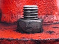 View Of Steel Nut And Bolt on red Steel