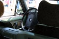 View of the steering wheel and cockpit dashboard in vintage style. Retro car. Royalty Free Stock Photo