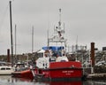 View of the stern of the bright red and white coast guard vessel the Cape Kuper at French Creek. Royalty Free Stock Photo