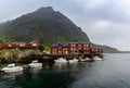 View of the Stockfish Museum in the Lofoten Islands with boats moored at the docks in the foreground Royalty Free Stock Photo