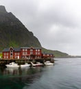 View of the Stockfish Museum in the Lofoten Islands with boats moored at the docks in the foreground Royalty Free Stock Photo