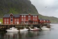 View of the Stockfish Museum in the Lofoten Islands with boats moored at the docks in the foreground Royalty Free Stock Photo