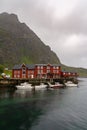 View of the Stockfish Museum in the Lofoten Islands with boats moored at the docks in the foreground Royalty Free Stock Photo