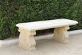 View of Stone Bench with Green Bushes Royalty Free Stock Photo