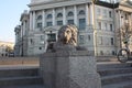 View of the stone lion and the building with the dome