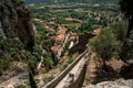 View of stone staircase, roofs and belfry under sunny blue sky in the charming village of Moustiers-Sainte-Marie. Royalty Free Stock Photo