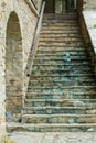 view of stone steps of an old house with arches and porch Royalty Free Stock Photo