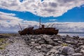 View of a stone trail the shipwreck of Plassey on the rocky beach of Inis Oirr Island with the sea in the background