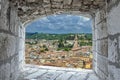 View from stone window on red rooftops and roofs in Verona, Italy. View from above of Verona old town Royalty Free Stock Photo
