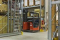 View of storage warehouse. Fork lift truck in warehouse store.