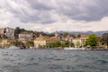 View from stormy, windy Lake Lugano to town Lugano on Switzerland Royalty Free Stock Photo