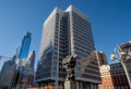 View of the 18-story light gray granite skin and projecting window frames government