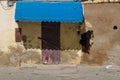 Closed shop with a blue marquise, El Jadida, Morocco