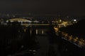 View of street lighting on bridges on the Vltava river in the city of Prague at night and lights from passing cars Royalty Free Stock Photo