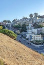 View of a street in a residential area from a slope in Kate Hill Park at San Francisco, CA