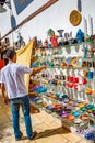 View of street sellers who sell traditional handmade art goods in Antalya historical downtown and old city at sunset warm