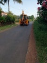 view of the street road with an earth mover vehicle Royalty Free Stock Photo