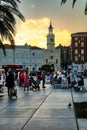 View of streetlife with architecture, vehicles, and locals in Zagreb, Croatia