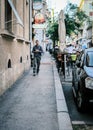 View of streetlife with architecture, vehicles, and locals in Zagreb, Croatia