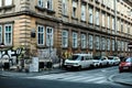 View of streetlife with architecture, vehicles, and locals in Zagreb, Croatia