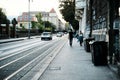 View of streetlife with architecture, vehicles, and locals in Zagreb, Croatia