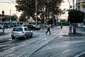 View of streetlife with architecture, vehicles, and locals in Zagreb, Croatia