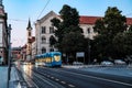 View of streetlife with architecture, vehicles, and locals in Zagreb, Croatia