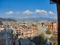 View of the streets, houses and the surrounding hills of Kathmandu, between the tourist district of Thamel and the Swayambhu stupa Royalty Free Stock Photo
