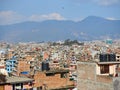 View of the streets, houses and the surrounding hills of Kathmandu, between the tourist district of Thamel and the Swayambhu stupa Royalty Free Stock Photo