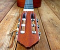 musical instrument - acoustic guitar - on a wooden background Royalty Free Stock Photo