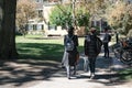 Students of prestigious Harvard University, MA, seen walking between lectures. Royalty Free Stock Photo