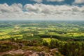 View on a stunning country side from a top of a hill, Green forest and fields and blue cloudy sky. County Tipperary, Ireland. Royalty Free Stock Photo