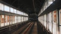 View of subway tunnel as seen from the rear window of moving train. Fast underground train departs from modern subway Royalty Free Stock Photo