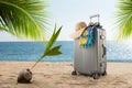 Suitcase with hat, pareo and sunglasses on sunny tropic beach