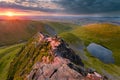 Stunning Sunrise On Blencathra Mountain Ridge With Small Tarn/Lake. Royalty Free Stock Photo