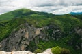 View of the summit of green mountains over Furlo gorge on cloudy day of May Royalty Free Stock Photo